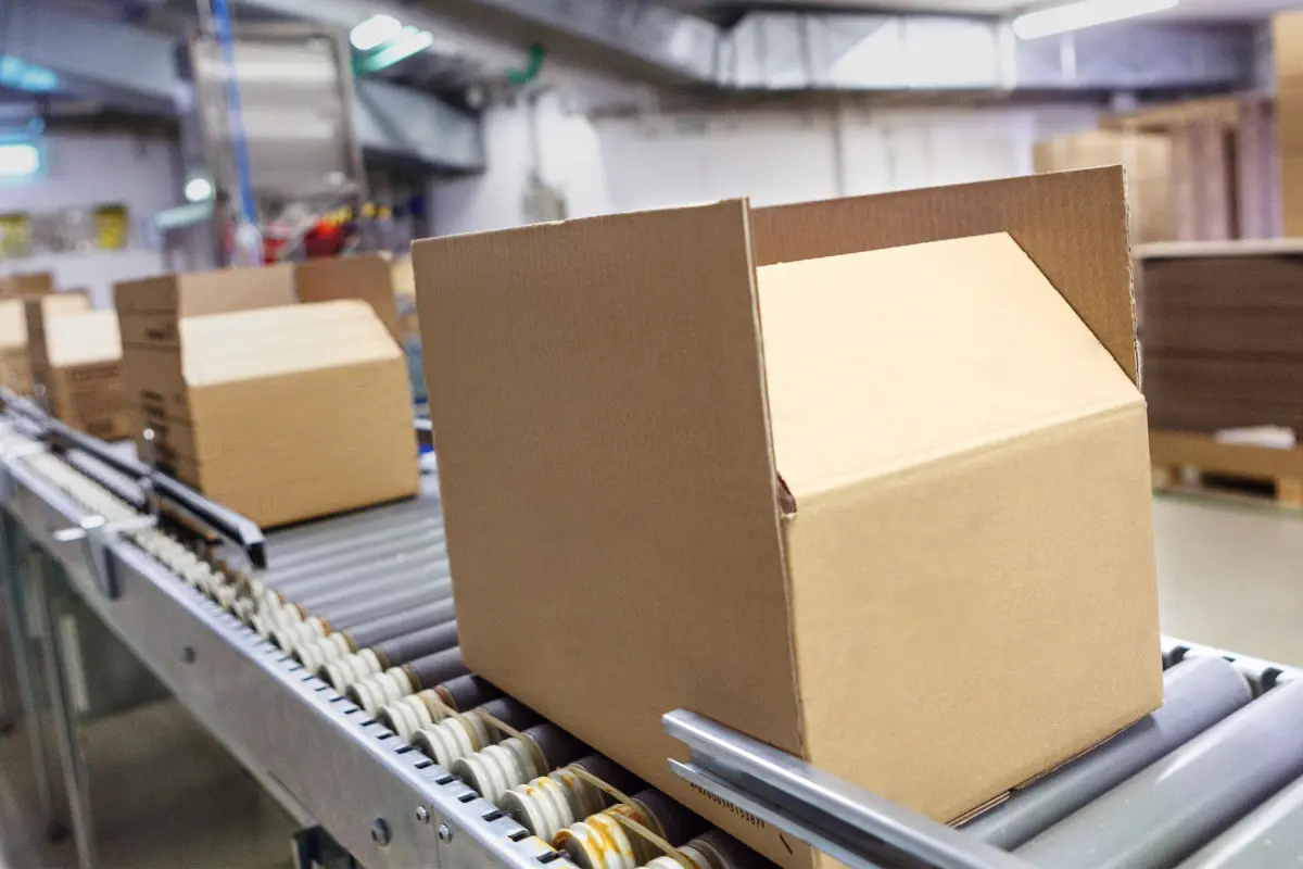 Shipping boxes on conveyor belt ready to be labelled or marked
